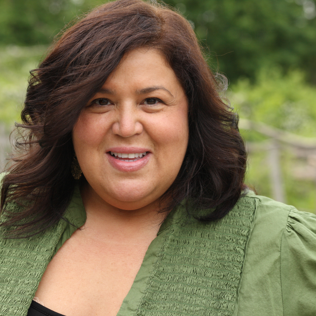 smiling woman in green